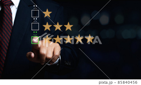 man touching the virtual screen on the smiley face icon on the digital touch screen. Customer service evaluation concept. 85840456