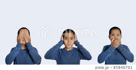 portrait of young man covering eyes, ears and mouth isolated background. portrait of young man covering eyes, ears and mouth isolated background. 85840701