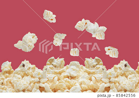 popcorn isolated on red background. popcorn isolated on red background. 85842556