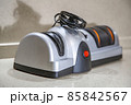 Modern electric knife sharpener in the home kitchen 85842567