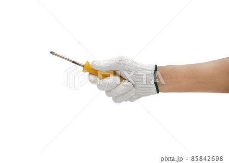 Worker hand holding screwdriver isolated on white background - clipping paths. Worker hand holding screwdriver isolated on white background - clipping paths. 85842698