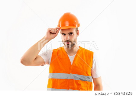 builder in hardhat and orange uniform. guy engineer or architect working. builder in hardhat and orange uniform. guy engineer or architect working. 85843829