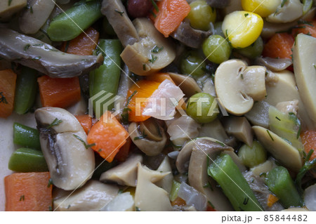 mushrooms and vegetables cooked in a frying pan mushrooms and vegetables cooked in a frying pan 85844482