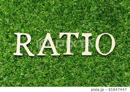 Wood letter in word ratio on green grass background Wood letter in word ratio on green grass background 85847447