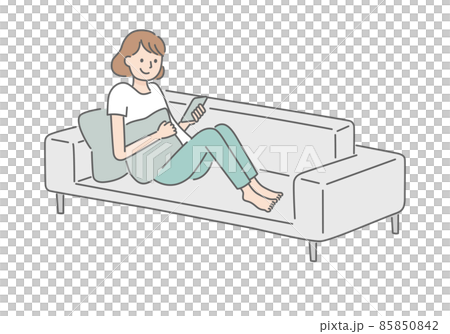 A woman relaxing while looking at her smartphone on the sofa 85850842