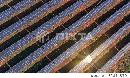 Aerial view of field with photovoltaic solar panels eco friendly renewable energy concept. Aerial view of field with photovoltaic solar panels eco friendly renewable energy concept. 85854330