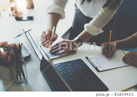 Fund managers team consultation and discuss about analysis Investment stock market by digital tablet. 85854415