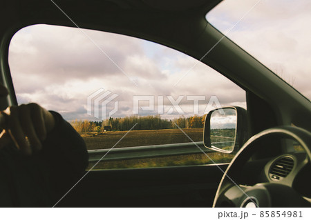 Man drives a car. View through the moving car windscreen. 85854981