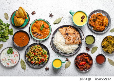Indian ethnic food buffet on white concrete table from above 85855942