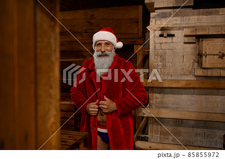 Santa Claus wrapped in bathrobe feeling cold 85855972