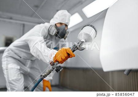 Painter in protective mask painting automobile door Painter in protective mask painting automobile door 85856047