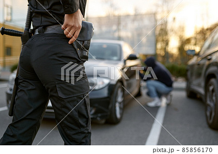 Police officer wants to arrest car thief 85856170