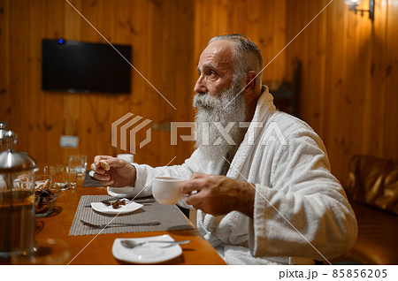 Senior man drinking tea rest in sauna 85856205