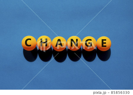 Change and business symbol. The concept word 'change' on orange table tennis balls on a beautiful blue background. Business and change concept. Change and business symbol. The concept word 'change' on orange table tennis balls on a beautiful blue background. Business and change concept. 85856330