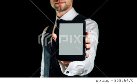 E book reader. Digital book, library reader tablet in business man hand. Concept of education, library, students. E book reader. Digital book, library reader tablet in business man hand. Concept of education, library, students. 85856470