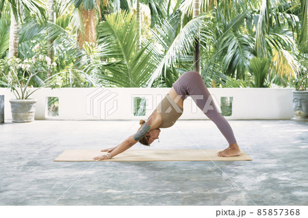 Woman Practicing Advanced Yoga on Organic Mat. Series of Yoga