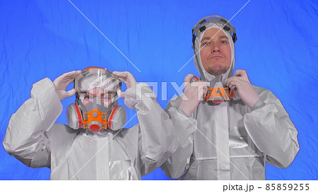 Doctor health worker in respirator. Slow motion. People portrait, wearing protect medical antibacterial antiviral aerosol spray paint mask. Doctor health worker in respirator. Slow motion. People portrait, wearing protect medical antibacterial antiviral aerosol spray paint mask. 85859255