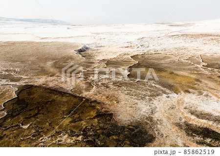 White travertine formations at hot springs of Pamukkale, Turkey White travertine formations at hot springs of Pamukkale, Turkey 85862519