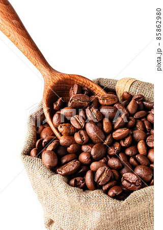 Burlap bag with coffee beans and wood scoop Burlap bag with coffee beans and wood scoop 85862980
