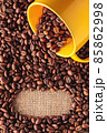 Coffee beans background with mug 85862998