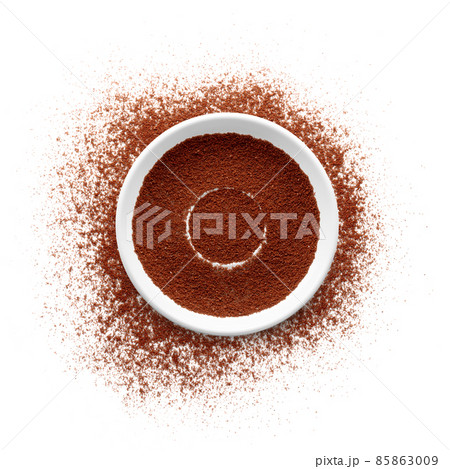 Coffee powder with saucer on white background 85863009