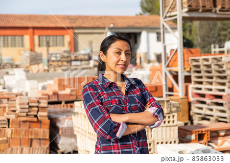 Portrait of woman seller of building materials at an open-air site Portrait of woman seller of building materials at an open-air site 85863033