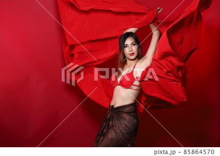 Young Slim Transgender Asian Woman wears red bikini bra dress, Beautiful Girl fluttering fabric 85864570