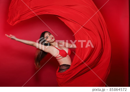 Young Slim Transgender Asian Woman wears red bikini bra dress, Beautiful Girl fluttering fabric Young Slim Transgender Asian Woman wears red bikini bra dress, Beautiful Girl fluttering fabric 85864572