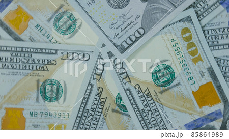 Many dollar are arranged around the edges of the image as a fram Many dollar are arranged around the edges of the image as a fram 85864989