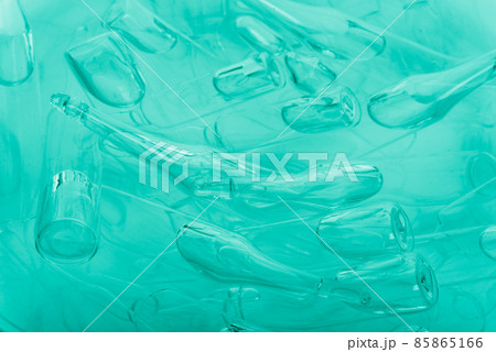 Glass medical ampoule vial for injection. Medicine is liquid sodium chloride with of aqueous solution in ampulla. Close up. Bottles ampule multicolor. 85865166
