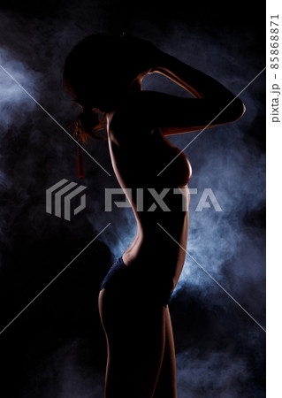 Portrait Swim wear of 20s Asian Woman in shadow low light key with back backlit, side rear view Portrait Swim wear of 20s Asian Woman in shadow low light key with back backlit, side rear view 85868871