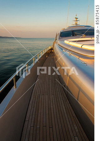 Beautiful sea view from the left board of a luxury yacht at sunset / sunrise - vertical orientation 85875415