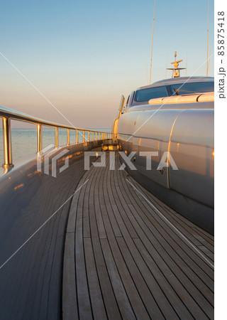 Beautiful sea view from the left board of a luxury yacht at sunset / sunrise - vertical orientation 85875418