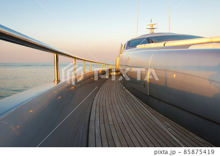 Beautiful sea view from the left board side of a luxury yacht at sunset / sunrise - horizontal orientation 85875419