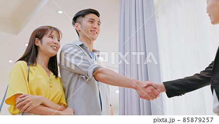 couple and real estate agent couple and real estate agent 85879257