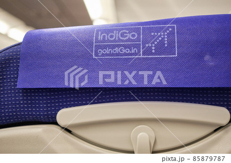 IndiGo logo on an airplane seat headrest IndiGo logo on an airplane seat headrest 85879787