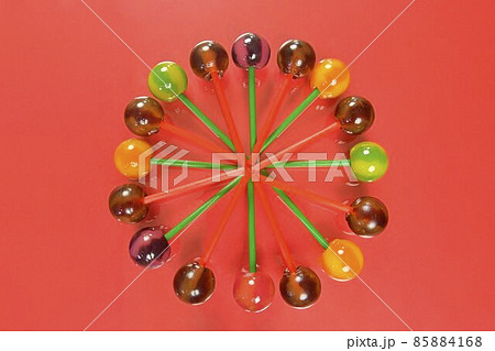 Mix of colorful lollipops. Children lollipops on a pastel background. Copy space, flat lay. Lollipops on an orange background 85884168