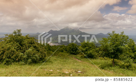 mountain view from a green clearing mountain view from a green clearing 85885622