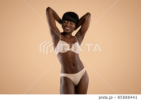 Sensual attractive black model posing in underwear, isolated Sensual attractive black model posing in underwear, isolated 85888441