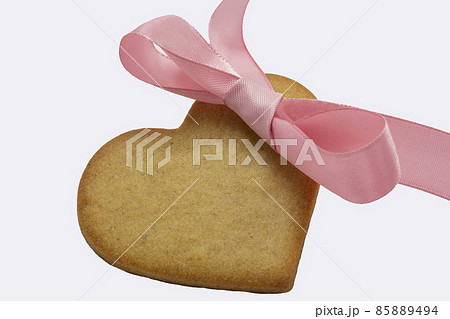 heart shaped cookie purple ribbon white background. Valentine Day, greeting card, pastry, Copy space, top view, love concept, Engagement, horizontal, valentine holiday february 14 85889494
