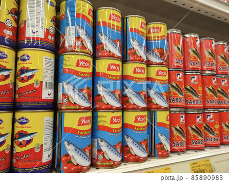 PENANG, MALAYSIA -DECEMBER 09, 2021: Selective focused on sardine fish can. The fish has been processed, cook and packed in the can. Displayed on the rack for sale and tag with the price tag 85890983