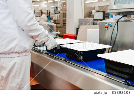 Chicken fillet production line . Factory for the production of food from meat.Modern poultry processing plant.Conveyor Belt Food.The meat factory. 85892103