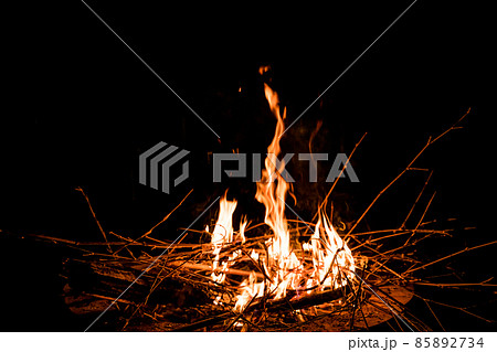 fire and flames. Flames and burning sparks close up, fire patterns. flames from the fire. Night bonfire, logs are on fire, sparks fly. soft focus.shallow focus effect.. 85892734