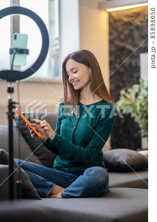 Young beautiful woman with a tablet in hands Young beautiful woman with a tablet in hands 85898050