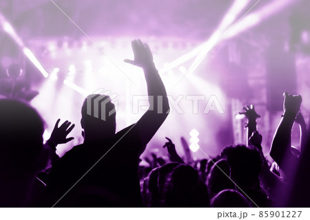 Crowd at a music concert, audience raising hands up, toned Crowd at a music concert, audience raising hands up, toned 85901227
