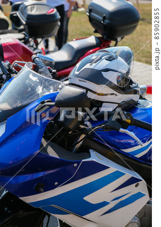 Parked Motorcycles. Store dealership motorbike manufactures shop. A motorbike on the show with chrome details and other parts, closeup 85902855