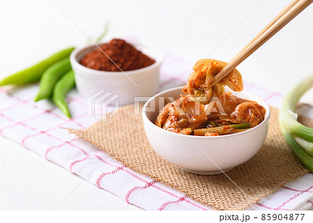 Korean kimchi cabbage in a bowl eating by use chopsticks Korean kimchi cabbage in a bowl eating by use chopsticks 85904877