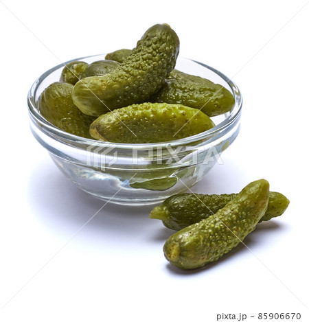Bowl of Tasty canned Whole green cornichons isolated on a white background 85906670