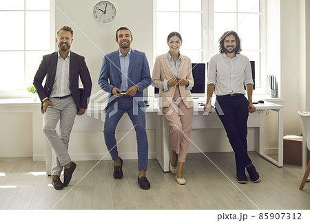Portrait of smiling diverse employees colleagues pose together show company unity teamwork in office. Happy motivated successful millennial gen z businesspeople at workplace. Bank, finance concept. 85907312