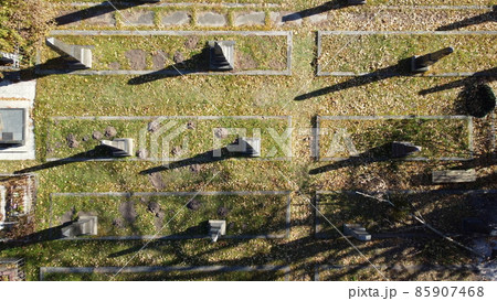 Arial drone view flight over old cemetery with tombstones, gravestones, arrows Arial drone view flight over old cemetery with tombstones, gravestones, arrows 85907468